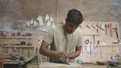 Carpenter measuring wood block. Carpentry work at workshop. Joiner man woodwork. 動画素材 271222036