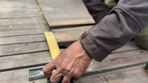 Carpenter measuring wood plank Stock Footage 293013113