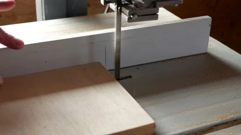 Carpenter with a missing finger cutting a piece of plywood Stock Footage 146314485