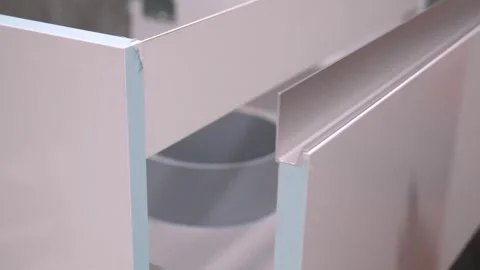 Carpenter opening and closing drawers of modern bathroom furniture Видео 304118326