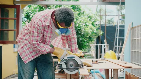 Carpenter or craftsman works by using machines to work on the construction site. Stock Footage 132092971