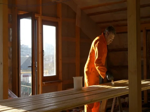 The carpenter painter processes the wood material for floor. Stock Footage 73248360
