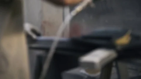 Carpenter is painting a sample of frame for canvas using black paint. Stock Footage 72256655