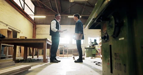 Carpenter, people and handshake in workshop with deal, trust and manufacturing Stock Footage 340627773