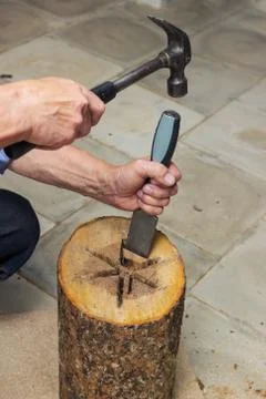 Carpenter performs  internal cavity of birdhouse Stock-Fotos