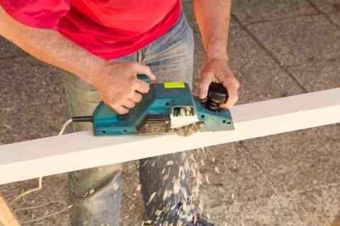 Carpenter with plane tool Photos