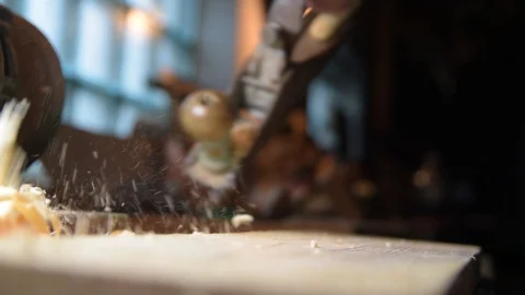 Carpenter with a planer at work in the workshop. Slow-motion close-up Video stock 128365471