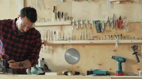 The carpenter planes the wood Stock Footage 61447003