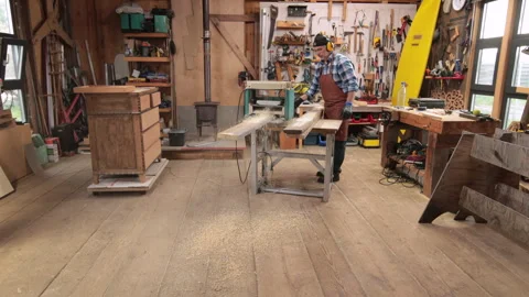 A carpenter is planing boards Stock Footage 322922979