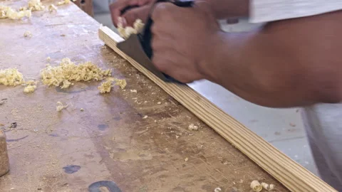 Carpenter planing wood in workshop Video stock 337552273