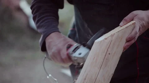 Carpenter polishing timber wood using grinder Stock Footage 57220428