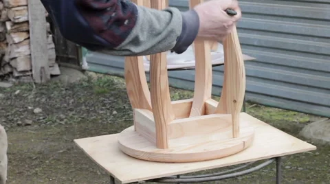 Carpenter is preparing stool for varnishing Stock Footage 63319029