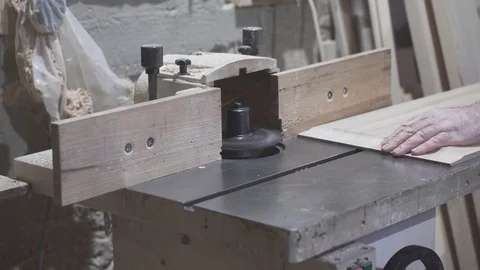 Carpenter process the lumber on the milling machine Stock Footage 105609743