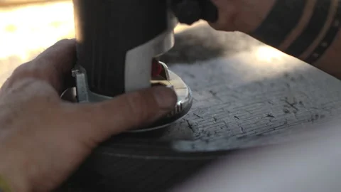 A carpenter processes a bog oak board with an electric router. milling cutter Stock Footage 144243494