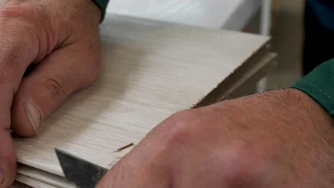 Carpenter processes a part with a knife, close-up Stock Footage 292931658
