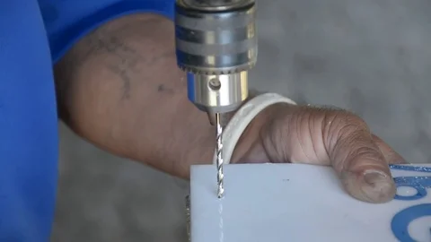 Carpenter' s hands using drill on acrylic plate Stock Footage 83792369