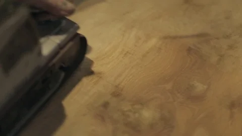 Carpenter Sanding the Surface of a Cut of Natural Wood Stock Footage 70304966