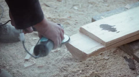 Carpenter sanding timber wood using grinder Stock Footage 57219616