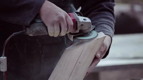Carpenter sanding timber wood using grinder Stock Footage 57220578