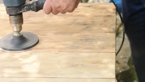 A carpenter sands a wooden surface. Stock Footage 250411376