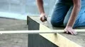 Carpenter sawing plank HD Footage
