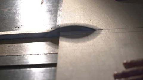 The carpenter saws the boards on a circular saw. Carpentry workshop Stock Footage 107613014