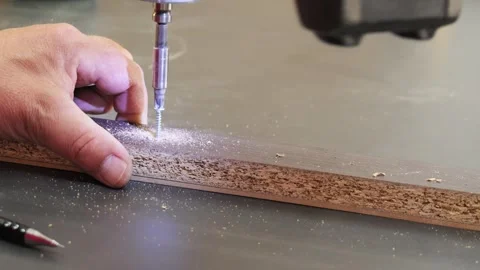 Carpenter screwing into particle board with cordless drill Video stock 335464046