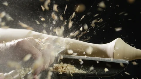 Carpenter shaping the wood with a chisel in the workshop Stock Footage 104219626