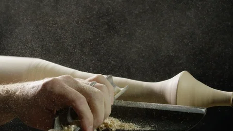 Carpenter shaping the wood with a chisel in the workshop Stock Footage 104219842