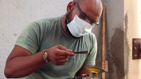 A Carpenter sharp his equipment with machine Stock Footage 161937152