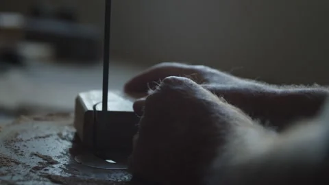 Carpenter skillfully cuts wood using a table saw in a workshop setting Stock Footage 312712247