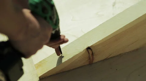 Carpenter spins screw screwdriver Video stock 59322353