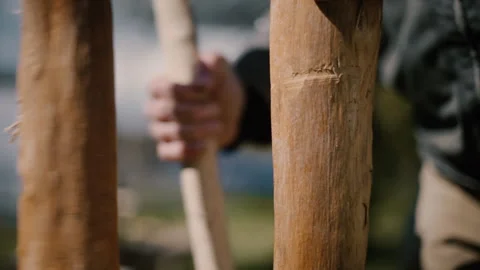 Carpenter splits log into two with froe, traditional tool, slow motion Stock Footage 271195779