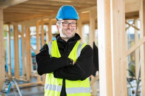 Carpenter Standing Arms Crossed While Looking Away Stock Photos