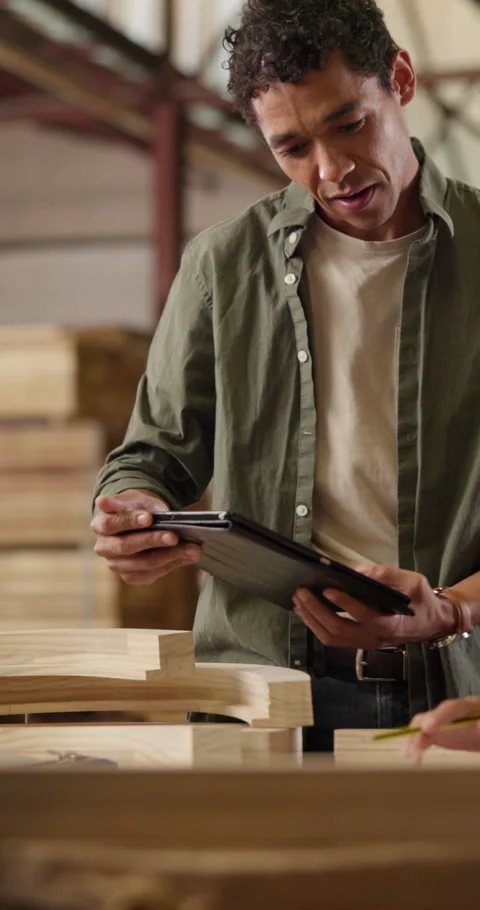 Carpenter, tablet and team planning in workshop for timber quality assessment Stock Footage 340977911