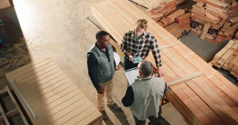 Carpenter, team and planning above for manufacturing, timber inventory or Stock Footage 341304692