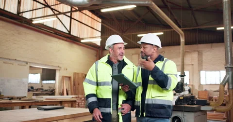 Carpenter, team and planning in workshop with tablet, discussion and idea for Stock Footage 338035387