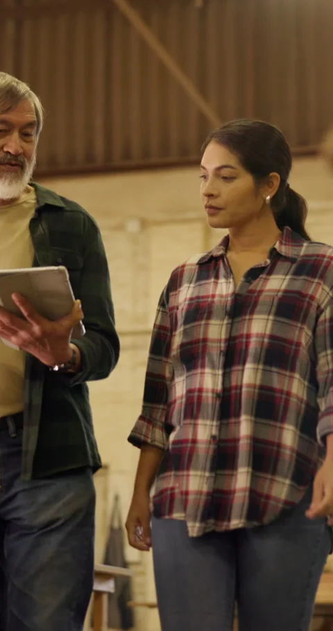 Carpenter, team and planning in workshop with tablet, discussion and proposal Stock Footage 340987510