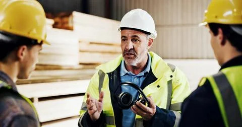 Carpenter, teamwork and men with ideas in workshop, discussion and planning.. Stock Photos