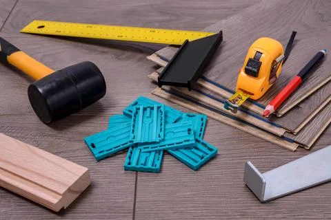 Carpenter tools on laminated flooring Stock Photos