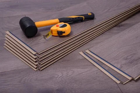 Carpenter tools on laminated flooring Stock Photos