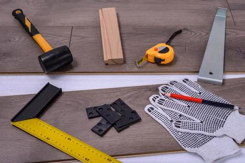 Carpenter tools on laminated flooring Stock Photos