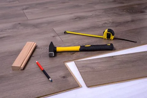 Carpenter tools on laminated flooring Stock Photos