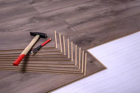 Carpenter tools on laminated flooring Stock Photos