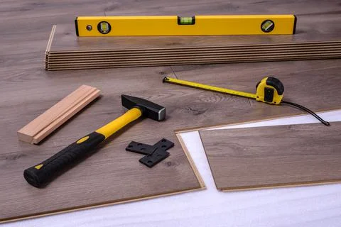 Carpenter tools on laminated flooring Stock Photos