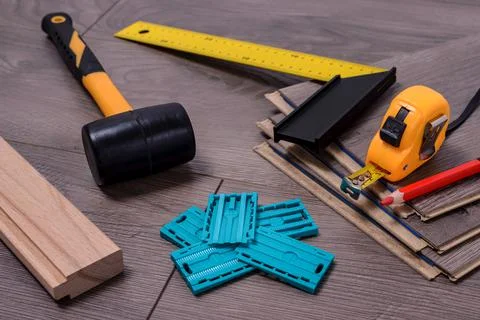 Carpenter tools on laminated flooring Stock Photos