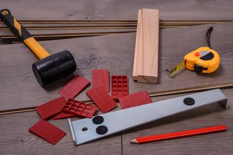Carpenter tools on laminated flooring Stock Photos