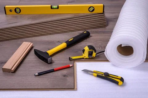 Carpenter tools on laminated flooring Stock Photos