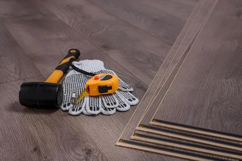 Carpenter tools on laminated flooring Stock Photos