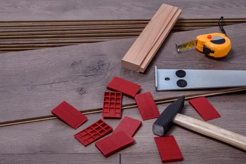 Carpenter tools on laminated flooring Stock Photos